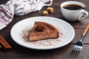 Slice of chocolate curd casserole on a plate, a portion piece of cake with chocolate and coffee....