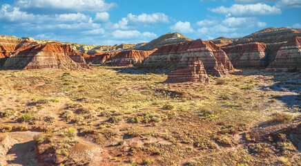 Aerial view from drone of a beautiful rise of red and orange rock formations due to erosion on the Toadstool Trail in Kanabe, Utah.