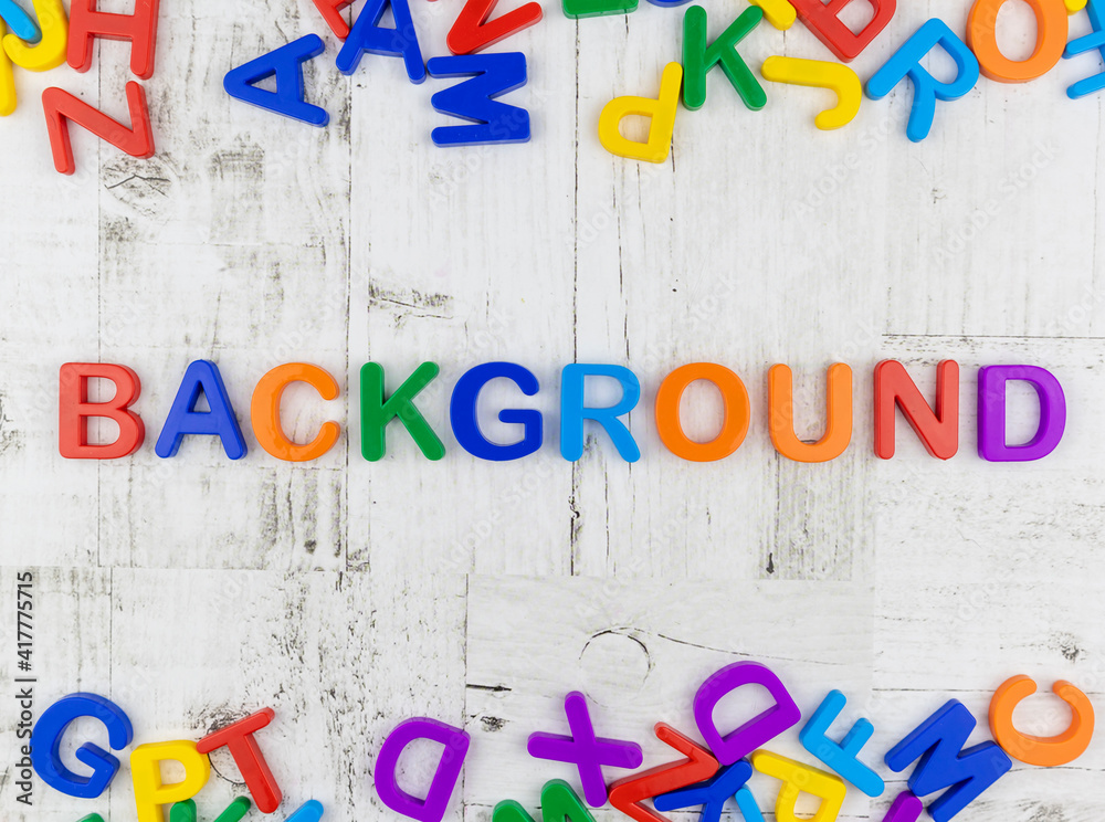 Fototapete word - background - in bright colorful alphabet letters with top and bottom matching border on grey 