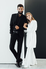 couple in love on date. business meeting fashion. formal fashion look. Proposal or engagement party. Formal couple of man in tuxedo and sexy woman. Bearded tuxedo man and woman. Always in style.