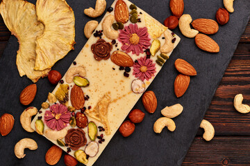 Handmade white chocolate with dried fruits and nuts