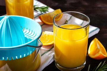 A glass of freshly squeezed orange juice in the sunlight. Morning breakfast. The beginning of the new day.