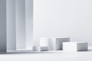 Minimalist abstract design for presentation and product display - white square podiums in sunlight...