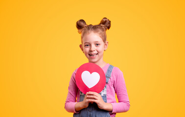 Positive little kid showing social media heart sign