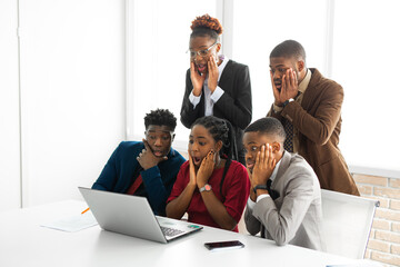 Fototapeta premium team of young african people in office with surprised faces 