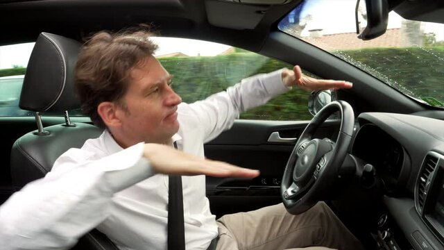 Happy man driving car dancing almost getting into accident
