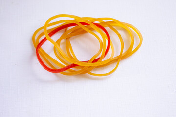 small rubber bands. Elastic bands. dragging an elastic band, isolated on white background
