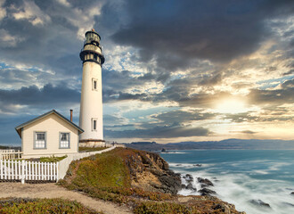 Pigeon Point lighthouse against the backdrop of a beautiful sky and ocean with waves, a great landscape of the Pacific coast in California