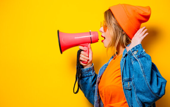 Girl In Jeans Clothes With Pink Megaphone