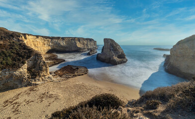 Long exposure shark fin cove, beautiful beach landscape on the coast of California highway, ocean, rocks, great sky, clear sunny weather