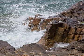 waves crashing on rocks