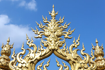 Fototapeta na wymiar Golden sculpture at Wat Rong Khun or White Temple, Chiang Rai, Thailand.