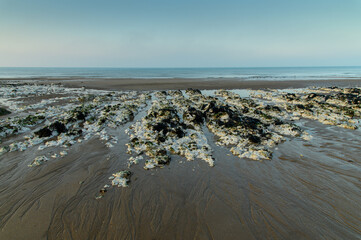 Chalk rocks, sand, and sea