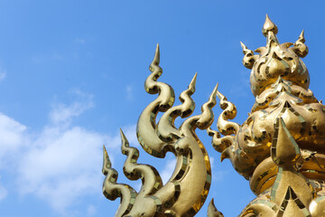 Golden sculpture at Wat Rong Khun or White Temple, Chiang Rai, Thailand.