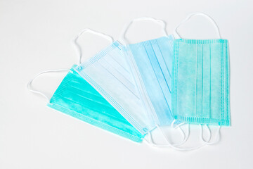 Surgical mask on white background, close-up.