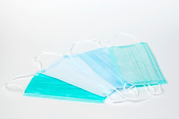 Surgical mask on white background, close-up.