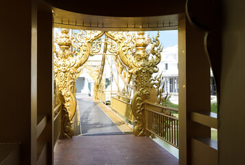 Golden sculpture at Wat Rong Khun or White Temple, Chiang Rai, Thailand.