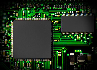 computer circuit board in green with transistors and chip