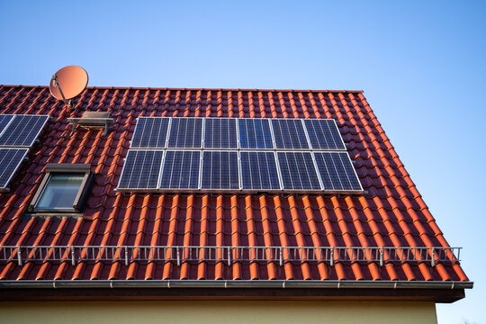 Photovoltaic system on the red tile roof, old version from 2005, 2.4 kWp, renewable energies
