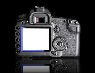 Digital Camera, back view. It is isolated on black background with reflection