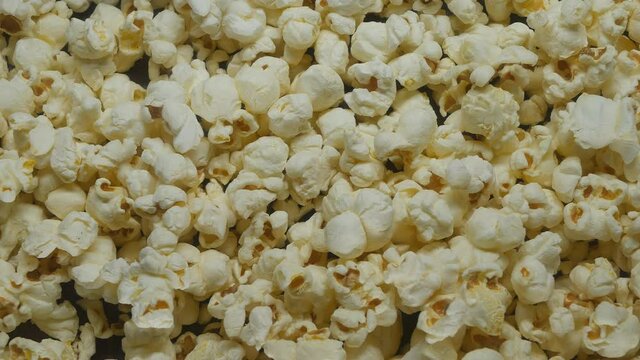 popcorn is poured evenly. Top view. Suitable for backgrounds. Slider, dolly cart.