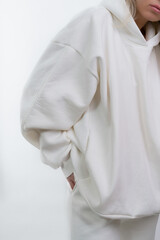 part of a white sweatshirt sport cut dressed for a girl model