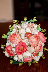 Morning of the bride. Bridal bouquet. Wedding candles in the church. Wedding rings in a red box. White shoes of the bride. Garter on the leg of the bride. Bridal accessories