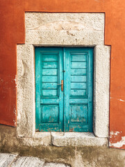 Old colored door in the town of Labin, Istria, Croatia