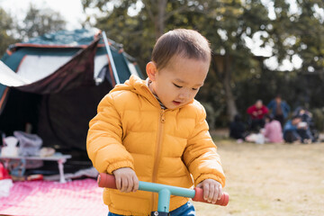 Asian Boys practice riding a balance car outdoors