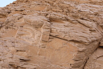 stone wall in the desert. beige rock wall texture. luxury natural rocky scenery. template for creative design of layout.