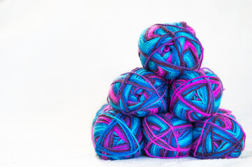 Six skeins of thread stacked on a white background on top of each other. Left place for text....