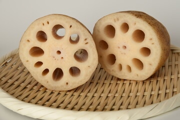 Fresh lotus root on bamboo basket.