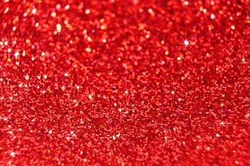 Red glitter background.Wallpaper phone shining glitter. shining red surface.New Year and Christmas background. Festive wallpaper