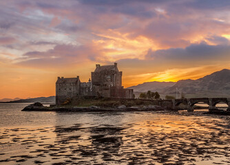 Fototapeta na wymiar The Eilean Donan Castle with colorful sunset, Highlands of Scotland