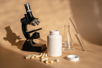 Laboratory for the creation and study of tablets. Omega 3 capsules. Chemical equipment, flasks and measuring cups. Top Hero. 
Pills from quality raw materials
