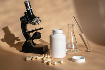 Laboratory for the creation and study of tablets. Omega 3 capsules. Chemical equipment, flasks and measuring cups. Top Hero. 
Pills from quality raw materials