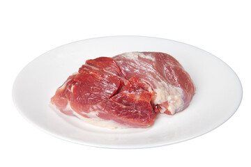 Pieces of raw meat on a white plate