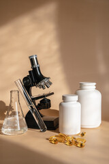 Laboratory for the creation and study of tablets. Omega 3 capsules. Chemical equipment, flasks and measuring cups. Top Hero. 
Pills from quality raw materials