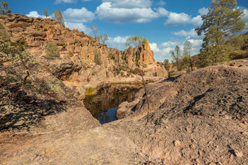Rock formations in Pinnacles National Park in California, the destroyed remains of an extinct volcano on the San Andreas Fault. Beautiful landscapes, cozy hiking trails for tourists and travelers.