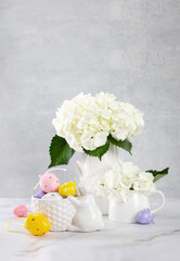 Easter home decorations setting with fresh flowers and eggs