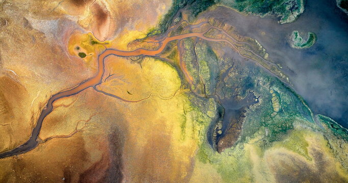 Dry lake or swamp in the process of drought and lack of rain or moisture, a global natural disaster - aerial drone view