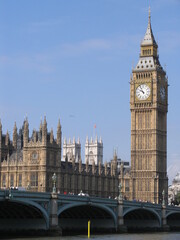 Fototapeta na wymiar London, United Kingdom - March 25 2005 Westminster palace with the tower bell called Big Ben, in a sunny day.