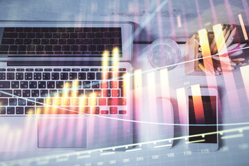 Multi exposure of forex graph drawing over desktop background with computer. Concept of financial analysis. Top view.