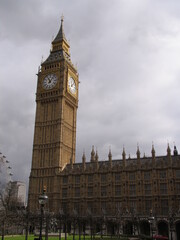 Fototapeta na wymiar London, United Kingdom - March 25 2005: Westminster palace with the tower bell called Big Ben, in a sunny day.