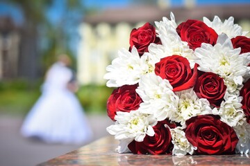 wedding bouquet close-up. Red and white flowers. Selective defocusing