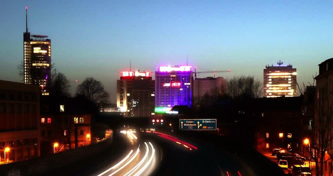 A40 motorway towards Essen, skyline city essen NRW germany at evening time lapse with long exposure evening hour
