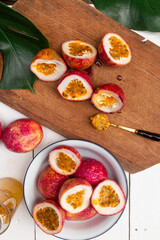 Passion fruit on wooden white background