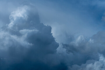 Fototapeta na wymiar Incoming dark storm clouds in sunlight