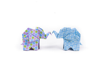 Closeup shot of colorful patterned origami elephants isolated on a white background