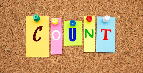 Color notes with letters pinned on a board. Word COUNT.